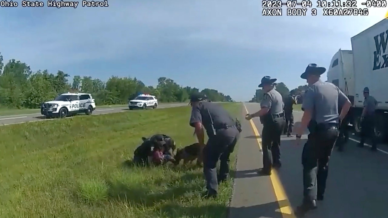 Ohio officer on paid leave after prompting K-9 attack on surrendering trucker