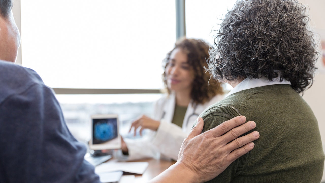 Older couple with doctor