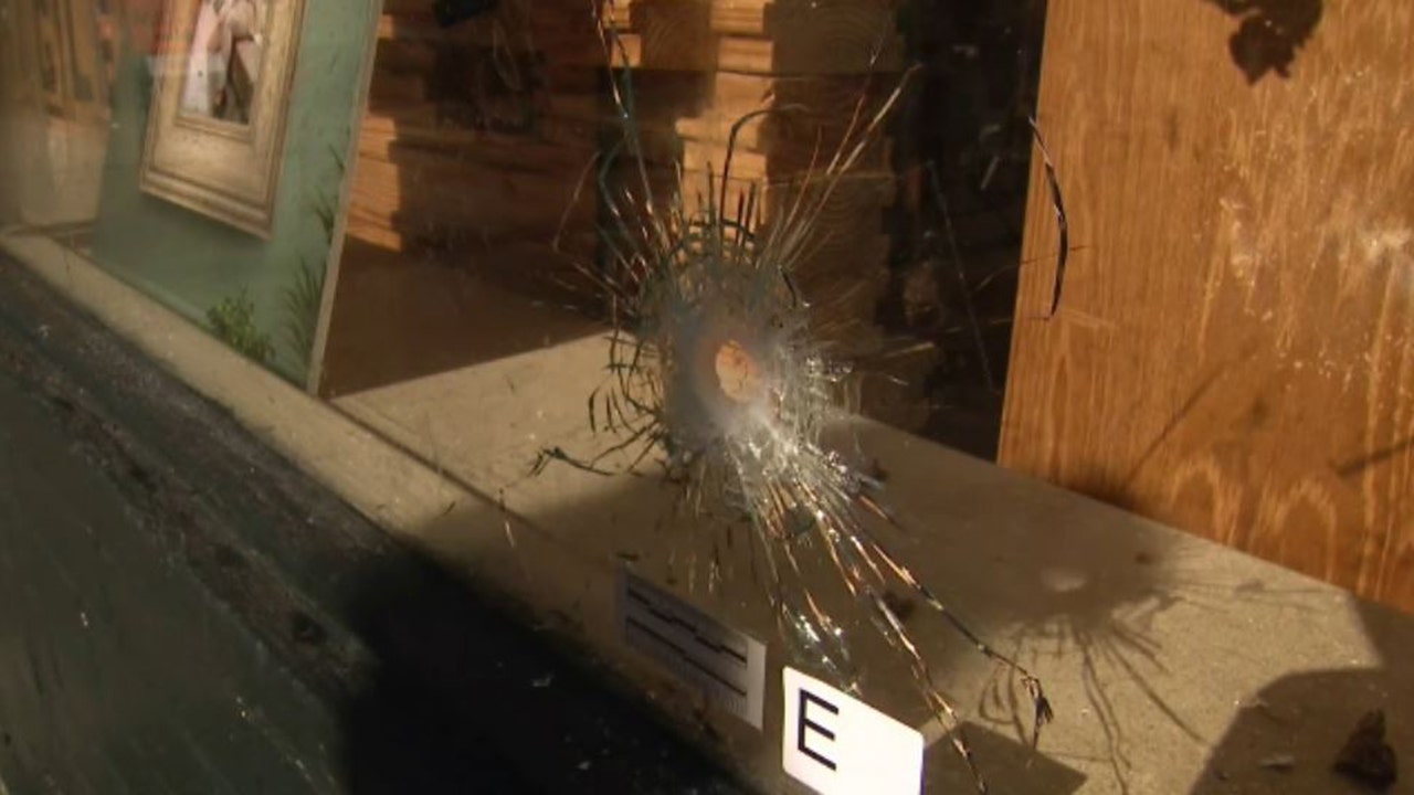 bullet hole in glass window