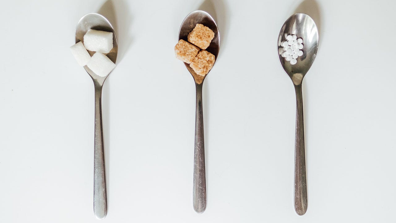 different types of sugar in spoons