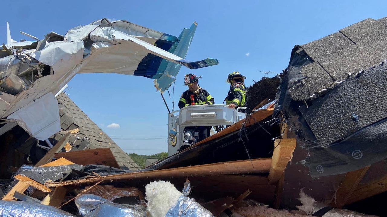Firefighters at the scene of the plane crash