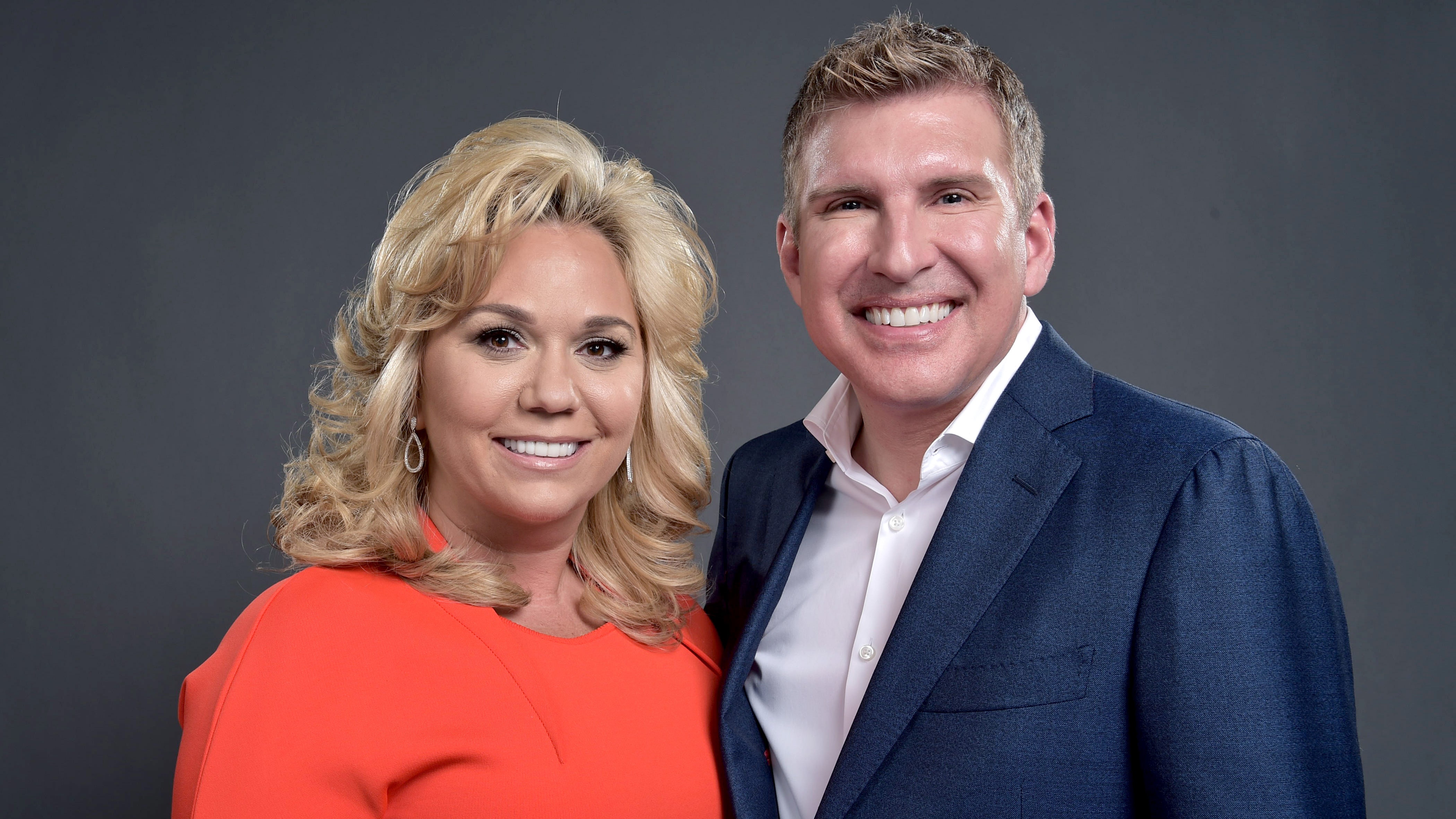 Todd and Julie Chrisley both reported to prison in January for bank fraud and tax evasion charges, but have had their sentences reduced due to good behavior. (Mike Windle/NBCUniversal via Getty Images)