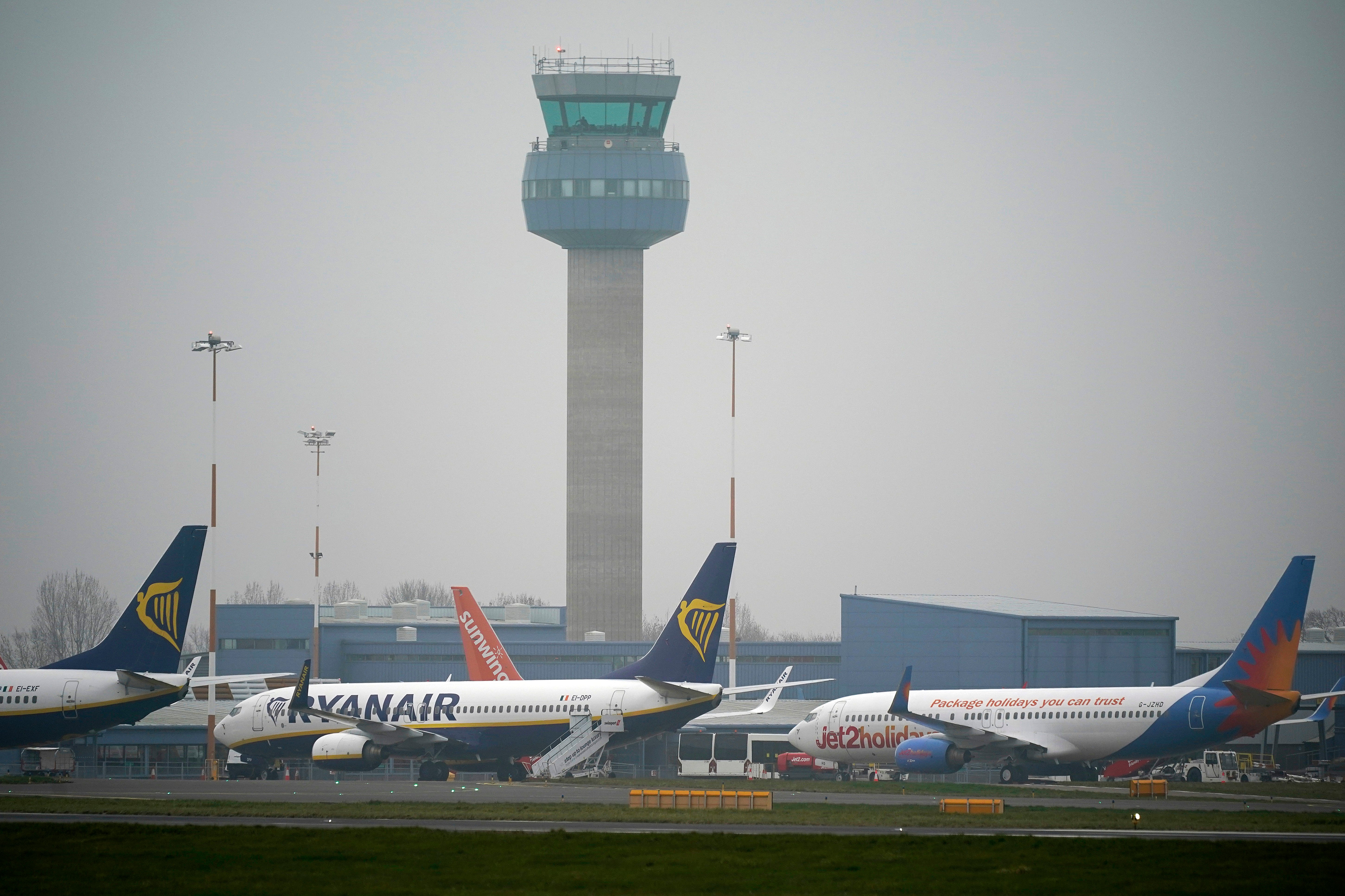 Video captures moment armed police escort man from plane due to 'explosive device' threat