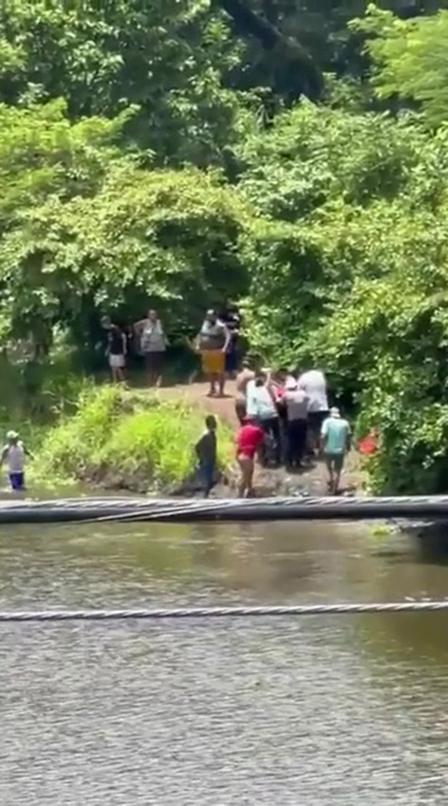 Soccer player dies from killer croc encounter while trying to cool off in river