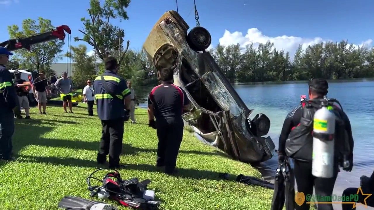 Miami Dade police department divers dredge up 32 cars from a lake in Doral Florida