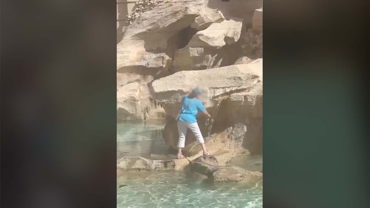 Rome tourist stuns onlookers by climbing across historic landmark to fill water bottle