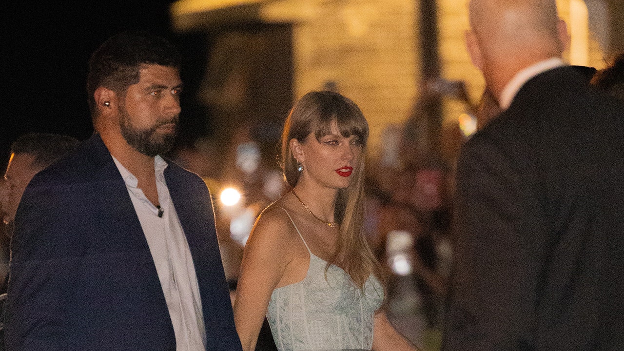 Taylor Swift stuns at wedding after causing chaotic mob scene at rehearsal dinner