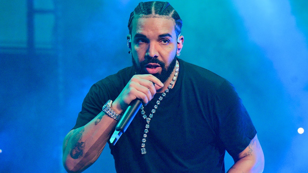 Drake rushes to female fan's aid as brawl breaks out after concert