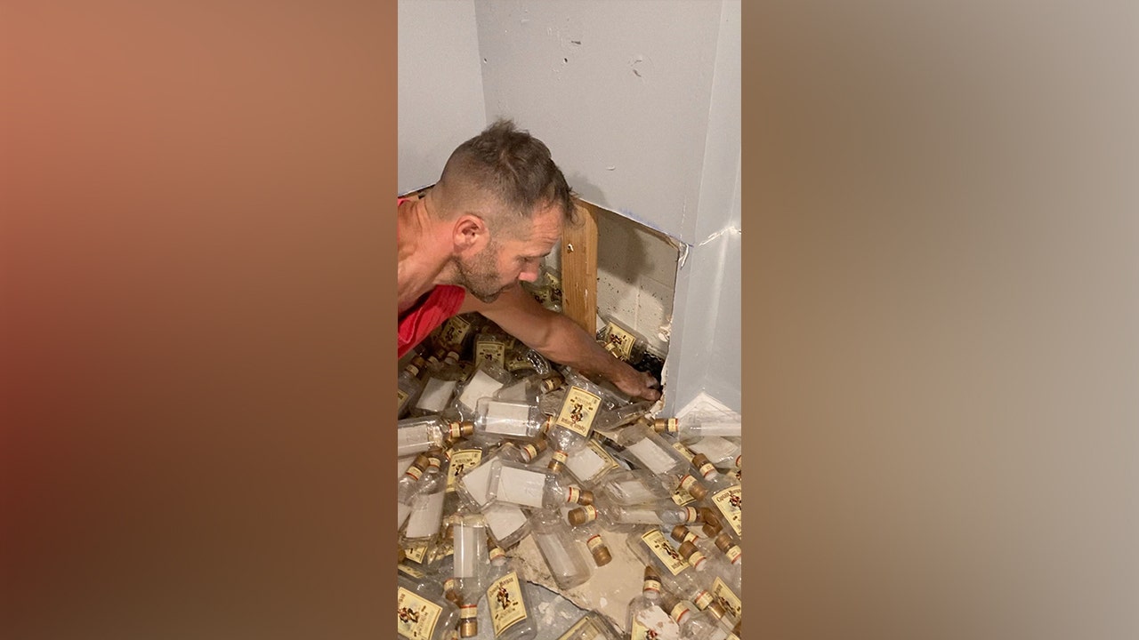 New Jersey couple uncovers hidden stash of empty rum bottles behind basement wall: ‘It’s 5 o’clock somewhere’
