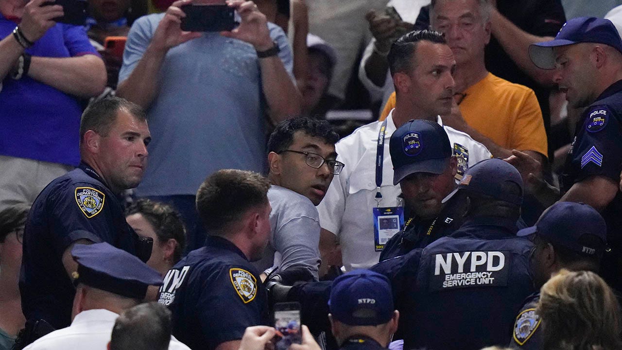 US Open protester who glued his feet to floor says NYPD took him to