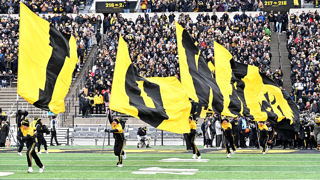 Watch the hilarious moment an Iowa cheerleader's PANTS fall down