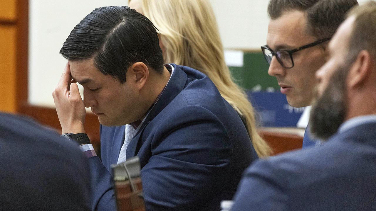 Officer Timothy Rankine listens during the murder trial of Manny Ellis