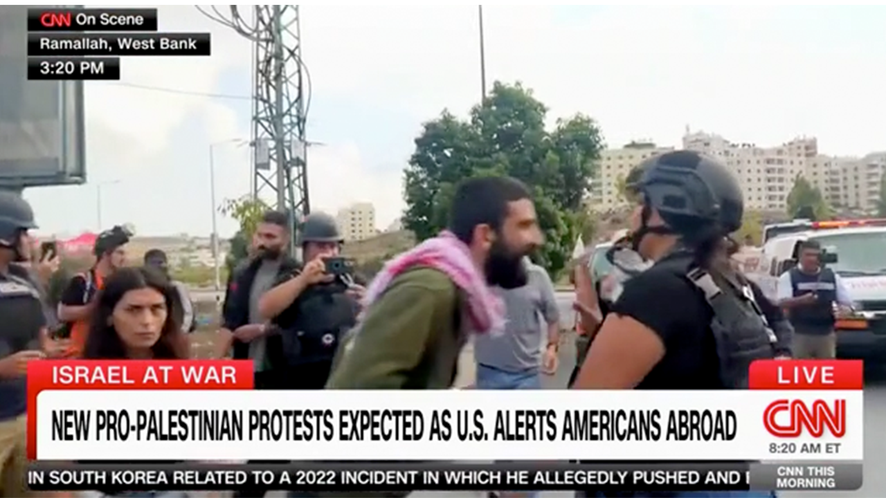 Palestinian protesters scream at CNN reporter in West Bank, security escorts her away