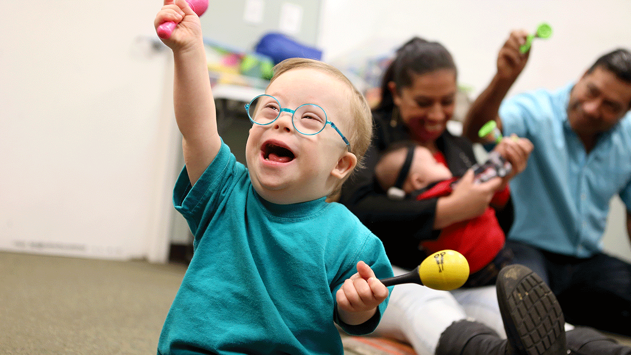A child with down syndrome in music class 