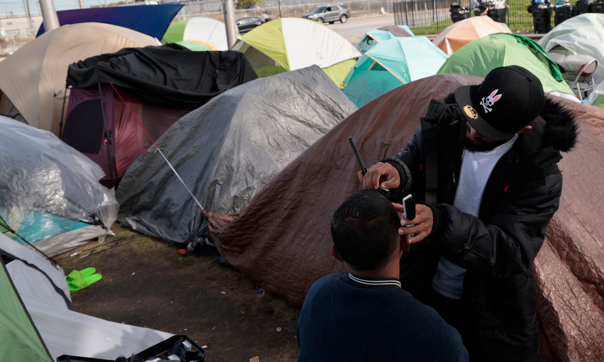Chicago struggles to house waves of migrants as freezing temperatures hit city