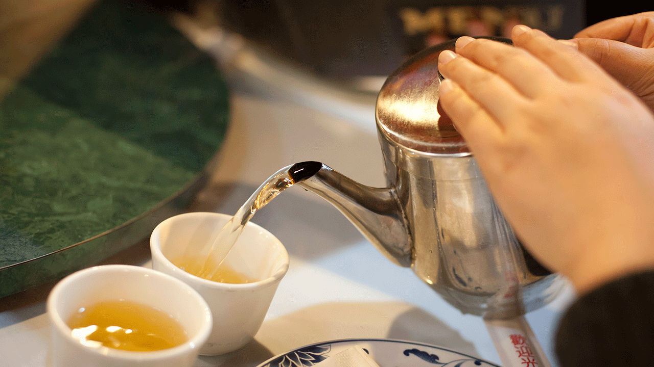 Green tea being poured