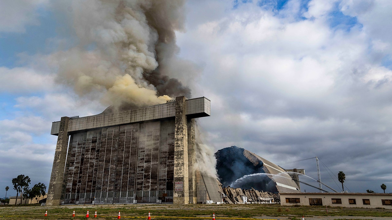 Massive blaze at California WWII-era blimp hangar closes parks, schools due to asbestos