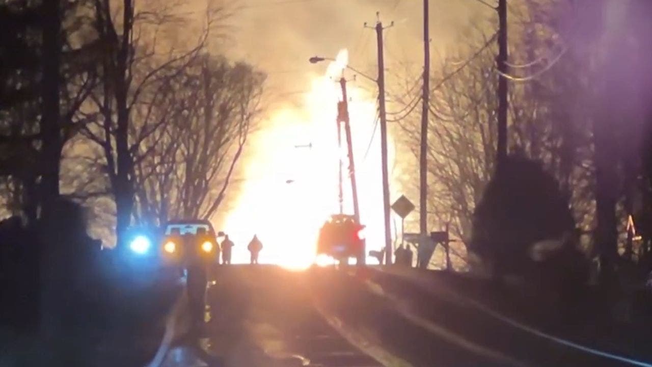 Tractor-trailer slams into NY bridge, sparking massive fire as train passes unscathed overhead