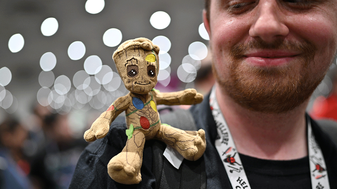 Baby Groot on man's shoulder at Comic Con