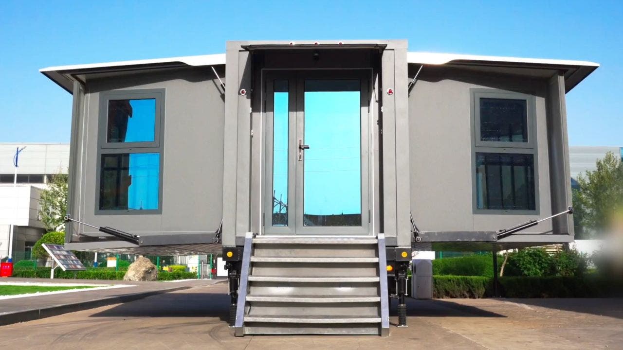 2 with the press of a button this tiny house folds into a box that you can tow anywhere