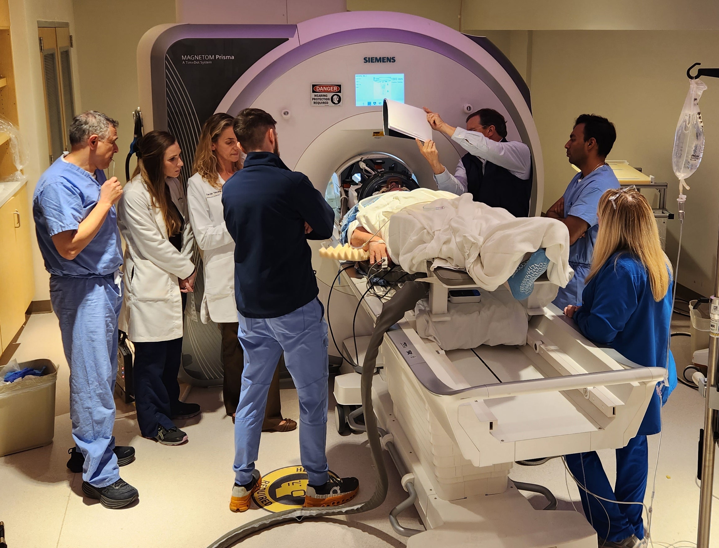 An Alzheimer's patient undergoes focused ultrasound treatment with the WVU RNI team. (Rockefeller Neuroscience Institute (RNI) at West Virginia University (WVU))