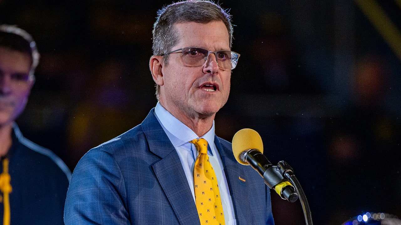 NCAA determines former Michigan coach Jim Harbaugh committed recruiting violations, issues penalty