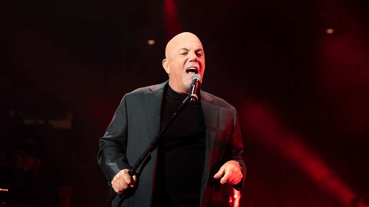 Billy Joel performing at concert