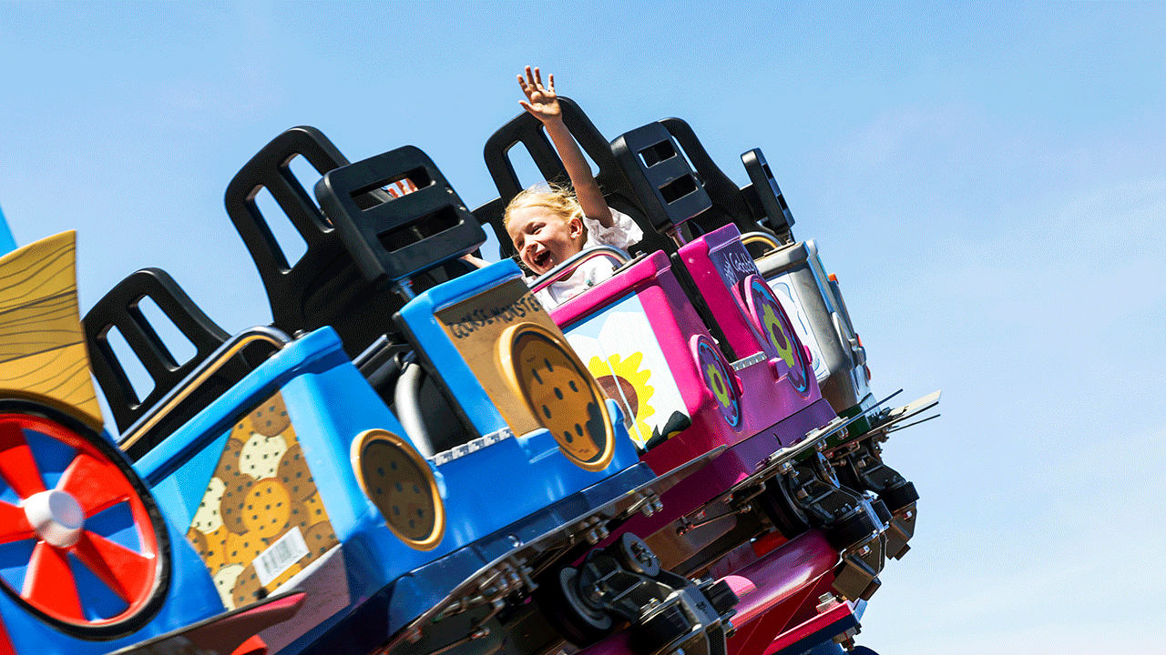 A girl riding roller coaster at Sesame Place