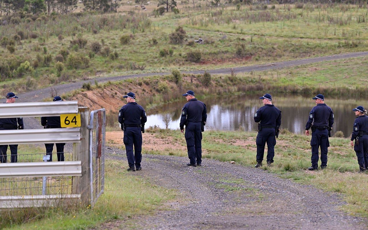 Divers search for bodies of Australia couple allegedly shot by police officer