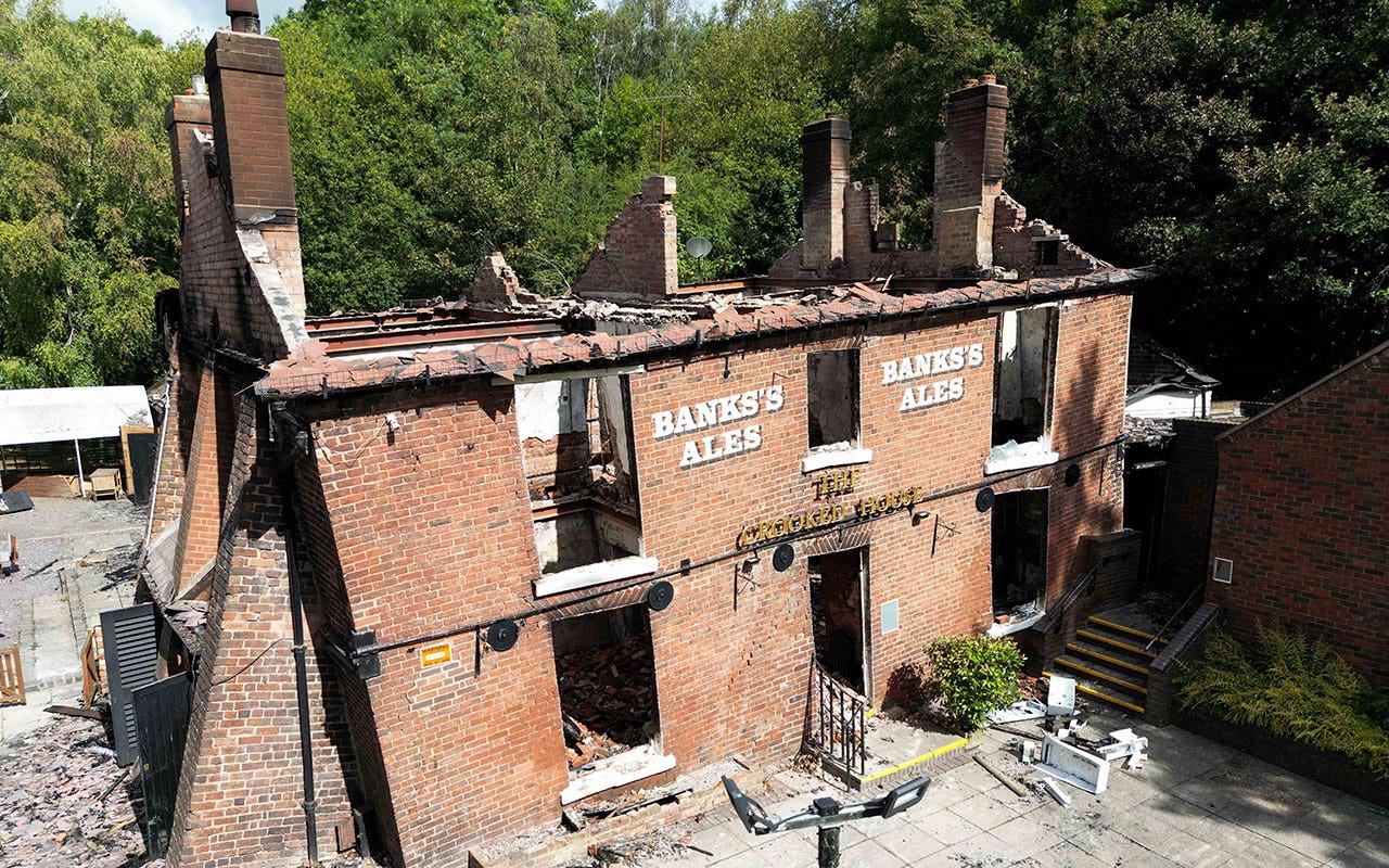 Council orders rebuilding of England's popular 'Crooked House' pub following fire