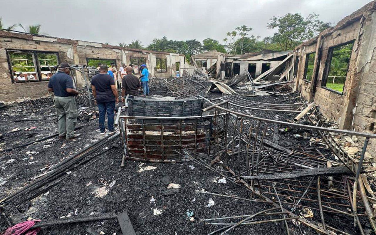 Read more about the article Parents of teens who survived fatal dorm fire in Guyana sue the government