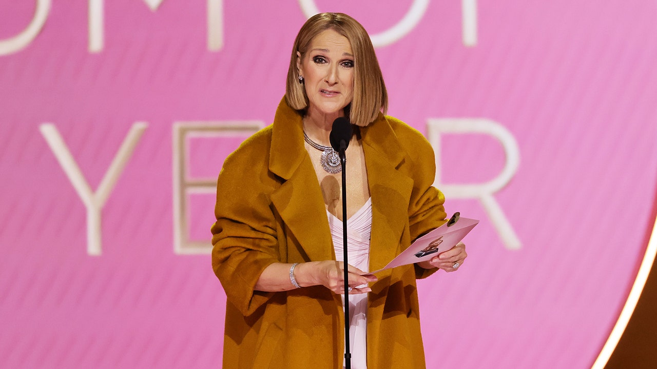 Cline Dion made a surprise appearance at the 66th Grammy Awards to present Album of the Year to Taylor Swift. (Kevin Winter/Getty Images for The Recording Academy)