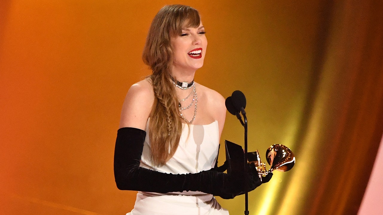 Taylor Swift announced her upcoming 11th studio album, 'The Tortured Poets Department,' at the Grammy Awards while accepting the award for Best Pop Vocal Album. (VALERIE MACON/AFP via Getty Images)