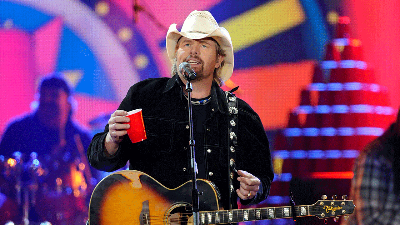 Toby Keith holding a red solo cup