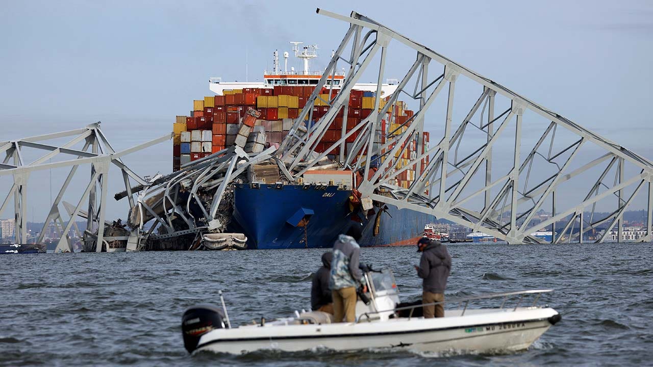 Baltimore bridge collapse: coast guard says 56 containers on cargo ship have hazardous materials