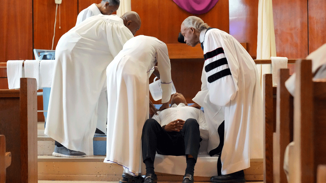 New York City’s mayor gets baptized in jail by Rev. Al Sharpton on Good Friday