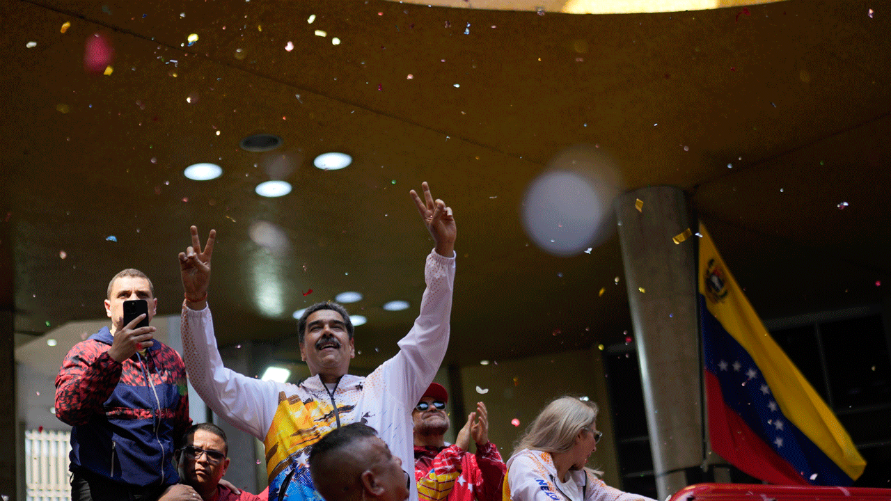 Maduro makes official re-election run while would-be rival struggles to register candidacy
