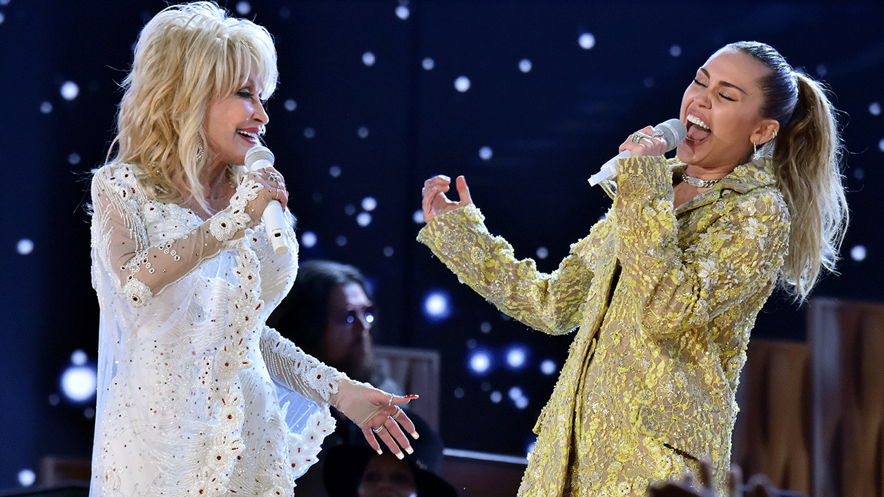 Dolly Parton performing at the Grammys with Miley Cyrus