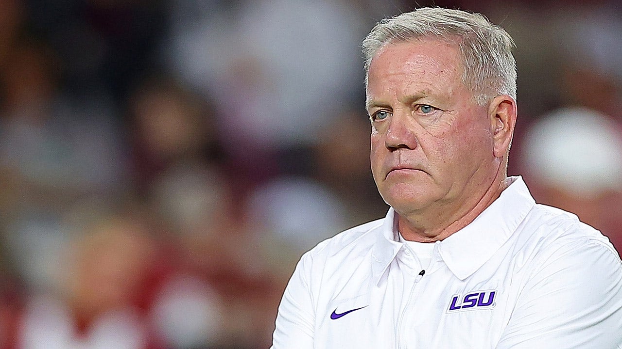 Read more about the article LSU’s Brian Kelly says if school wants team on field for national anthem, ‘we’re going to proudly stand’