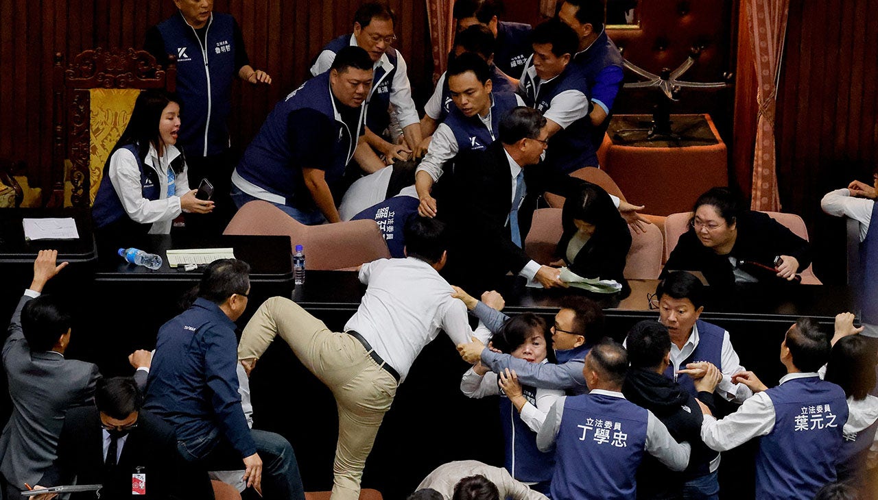 You are currently viewing Taiwan lawmakers punch, shove each other over reforms