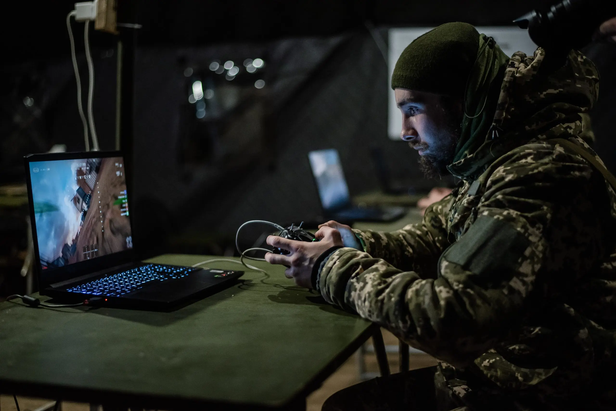 A recruit of the 1st Separate Mechanized Battalion 'Da Vinci Wolves' named after Dmytro Kotsiubailo trains and learns to work with FPV strike drones while undergoing five-day training at a military outdoor firing range on March 12, 2024, in central Ukraine. After training, recruits can join the Armed Forces of Ukraine to defend Ukraine in the war started in 2014 and escalated during the full-scale Russian invasion in 2022. (Valentyna Polishchuk/Global Images Ukraine via Getty Images)