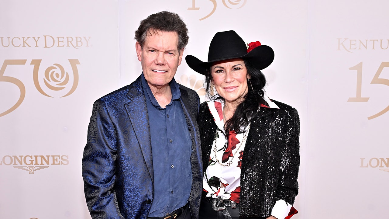 LOUISVILLE, KENTUCKY - MAY 04: (L-R) Randy Travis and Mary Davis attend the Kentucky Derby 150 at Churchill Downs on May 04, 2024 in Louisville, Kentucky. (Photo by Daniel Boczarski/Getty Images for Churchill Downs) (Daniel Boczarski/Getty Images for Churchill Downs)
