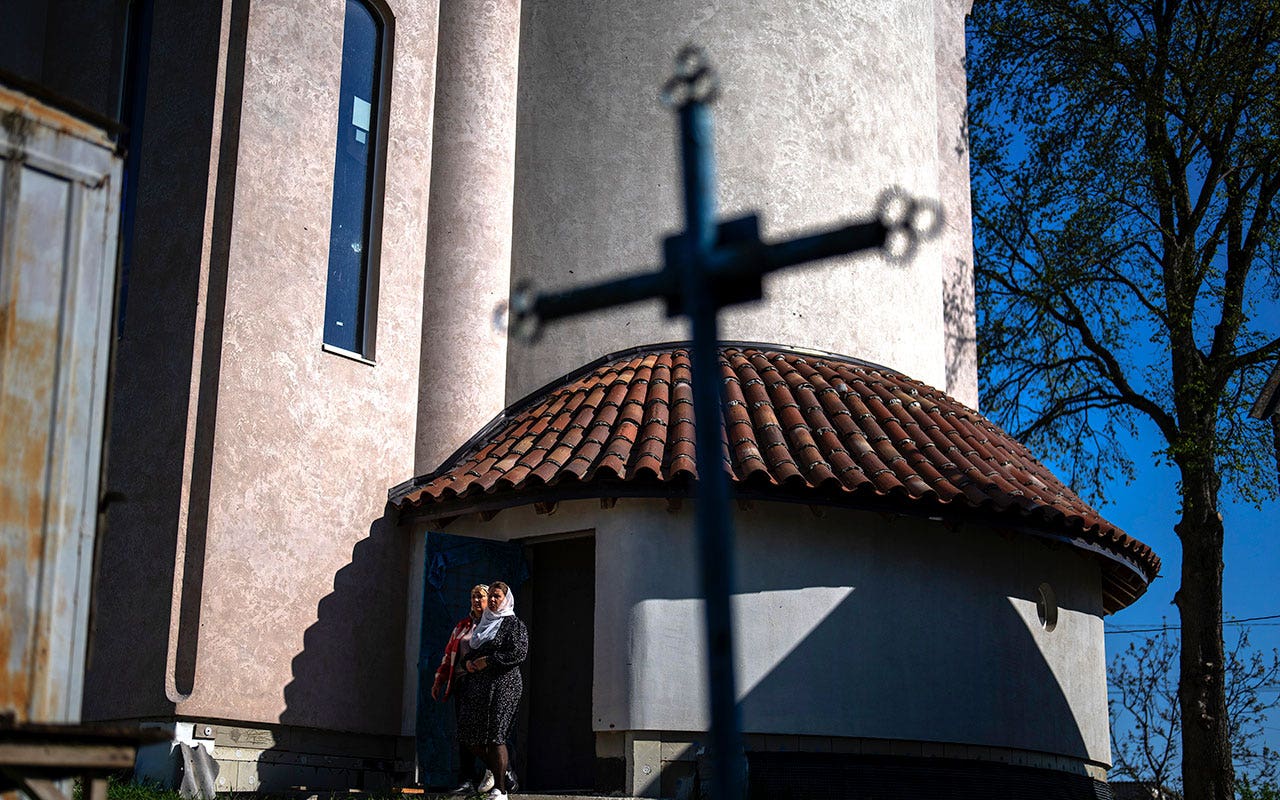 War-scarred village in Ukraine finds solace in vibrant new church