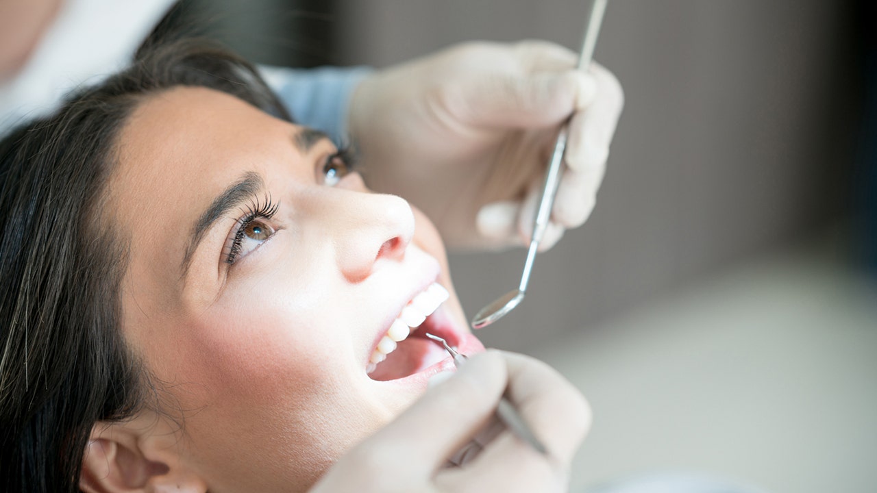Women experience more dental health issues than men, experts say. Here's what to do about it