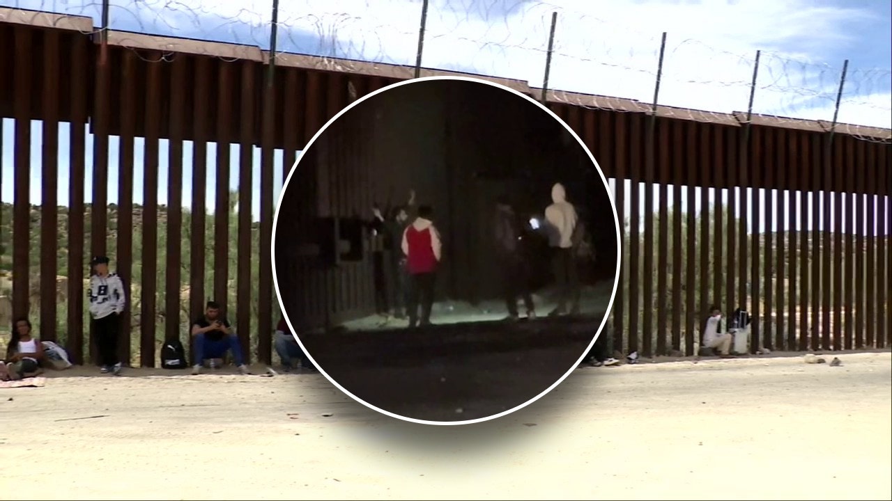 You are currently viewing Migrants crossing illegally into California snap photos at border wall
