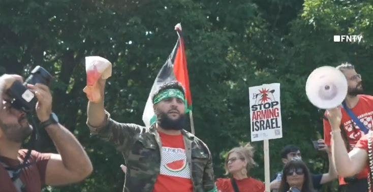 You are currently viewing Anti-Israel agitator in Hamas headband holds up bloodied Biden face mask steps from White House