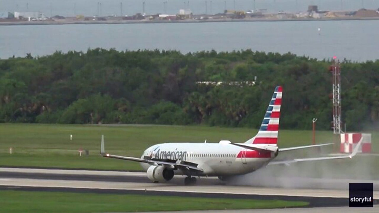 American Airlines aircraft blows tire in smoke-filled, fiery runway incident