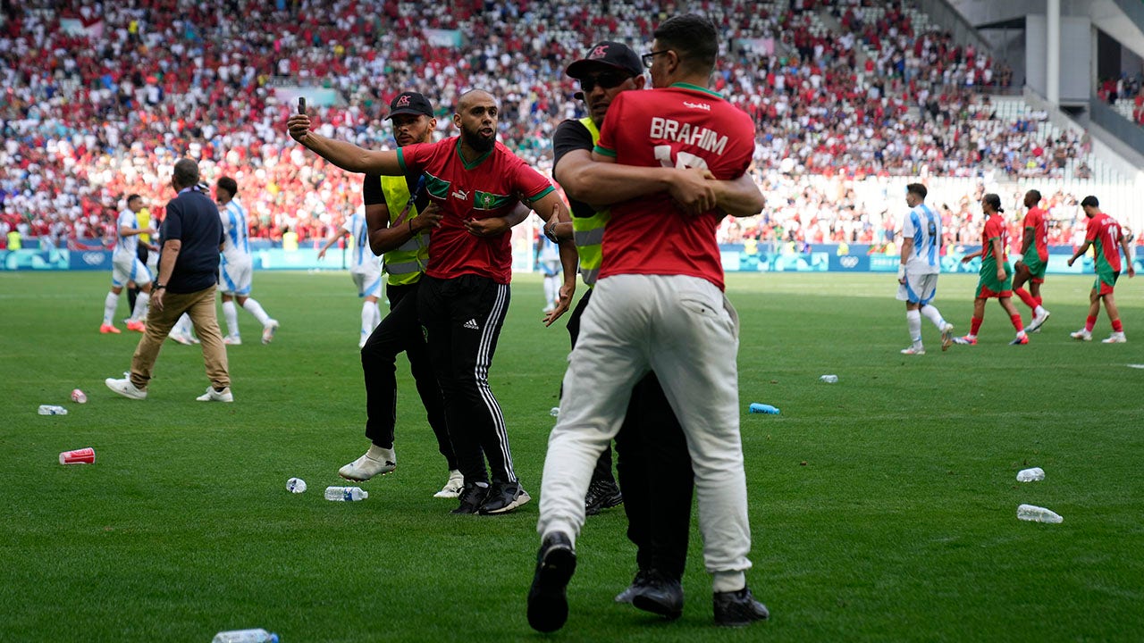 Paris Olympics men’s soccer play begins with chaotic Morocco win as fans storm and trash field