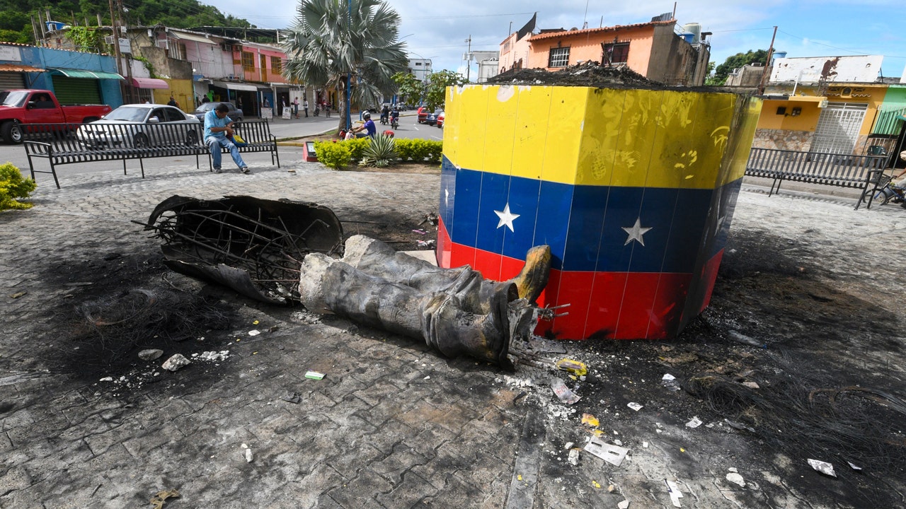 Chávez statues toppled across Venezuela as election protests rage on