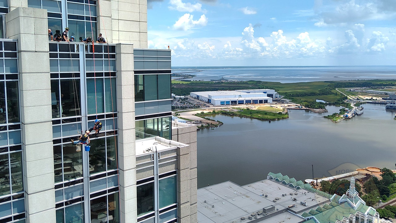 Alabama window washer dangling outside skyscraper rescued after equipment jams 450 feet above ground